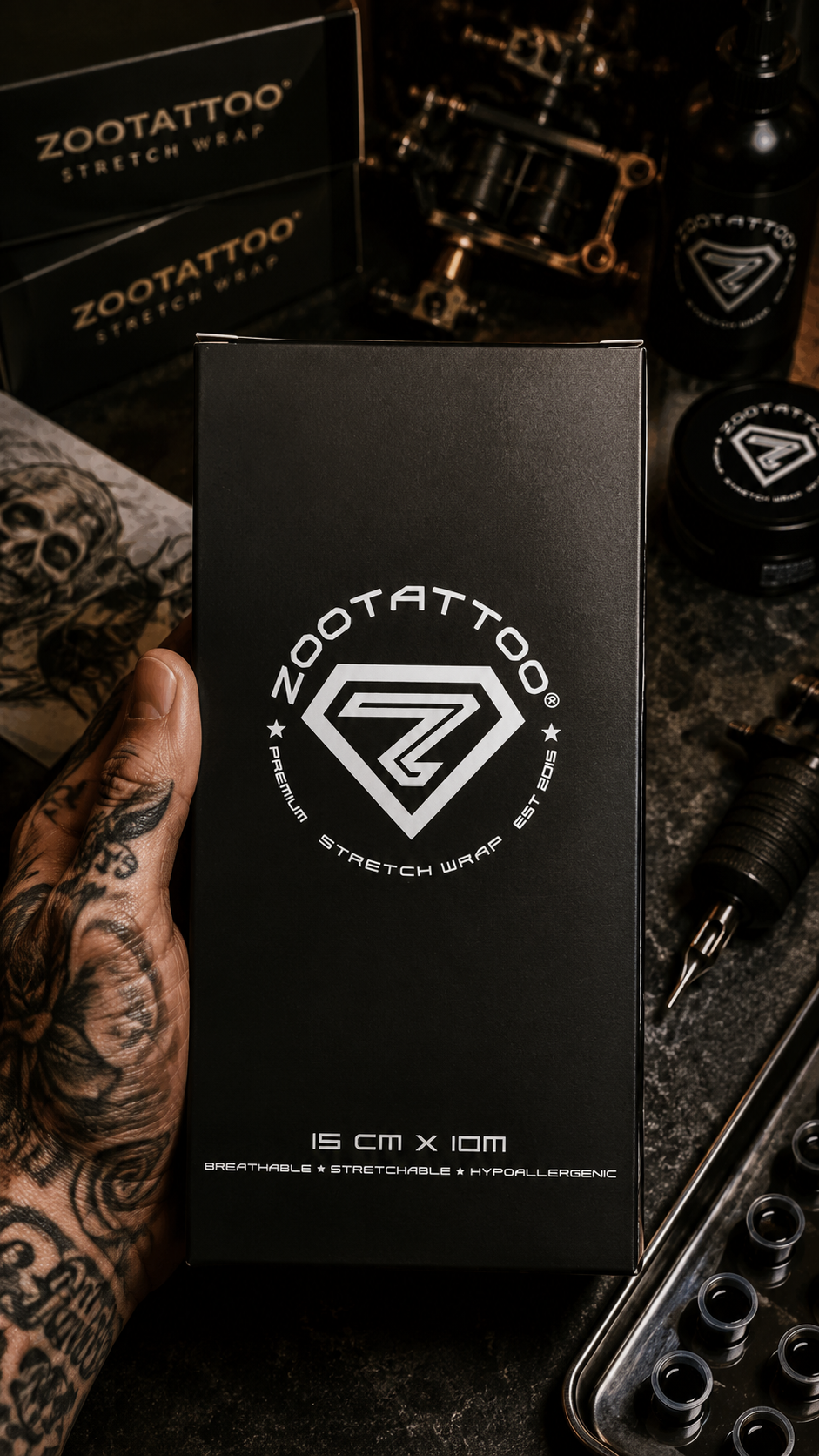 Zootattoo packaging with tattoo equipment on a dark background